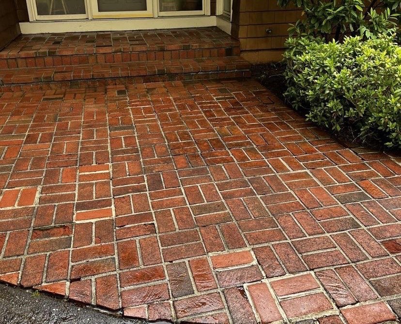 The same brick walkway and steps clean and bright after pressure washing