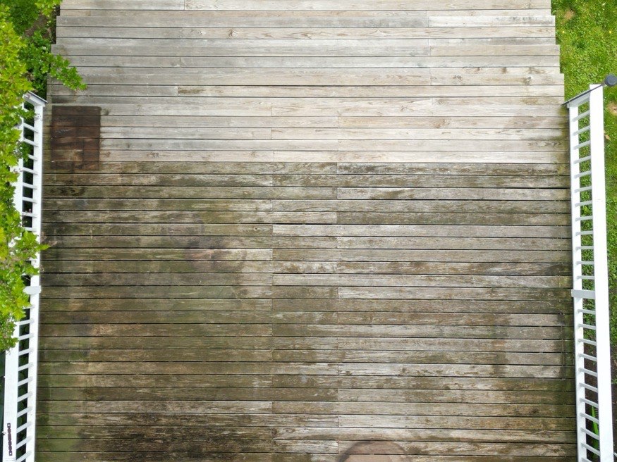 Weathered wood deck covered in mildew and grime, before washing